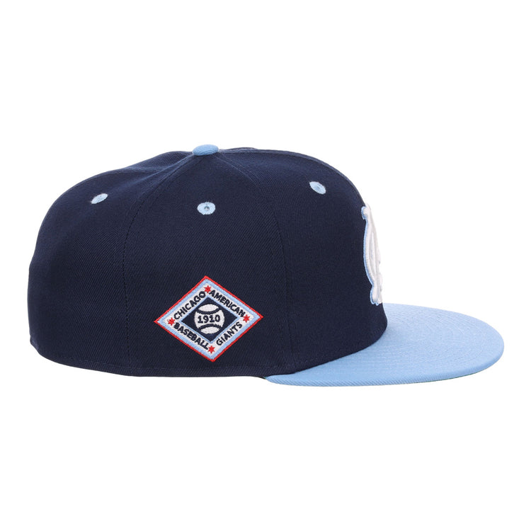 The EFF Chicago American Giants NLB Flip Fitted Ballcap features a navy crown, light blue brim, and a side patch reading Chicago Americans 1910 Baseball Giants in a red-bordered diamond—honoring the vintage legacy.
