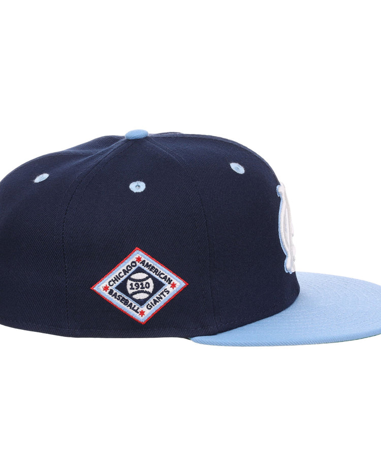 The EFF Chicago American Giants NLB Flip Fitted Ballcap features a navy crown, light blue brim, and a side patch reading Chicago Americans 1910 Baseball Giants in a red-bordered diamond—honoring the vintage legacy.