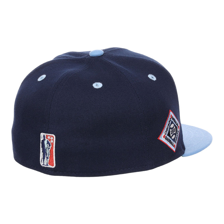 The EFF Chicago American Giants NLB Flip Fitted Ballcap is a navy cap with a light blue button and brim, vintage-inspired patches on back—a baseball player logo and diamond emblem—blending retro style with classic Negro League details.