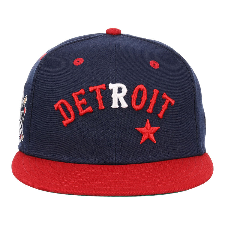 The EFF Detroit Stars NLB Flip Fitted Ballcap is a navy vintage-inspired cap with a red brim, DETROIT embroidered in red and white, and a red star on the front—a perfect tribute to the Detroit Stars.