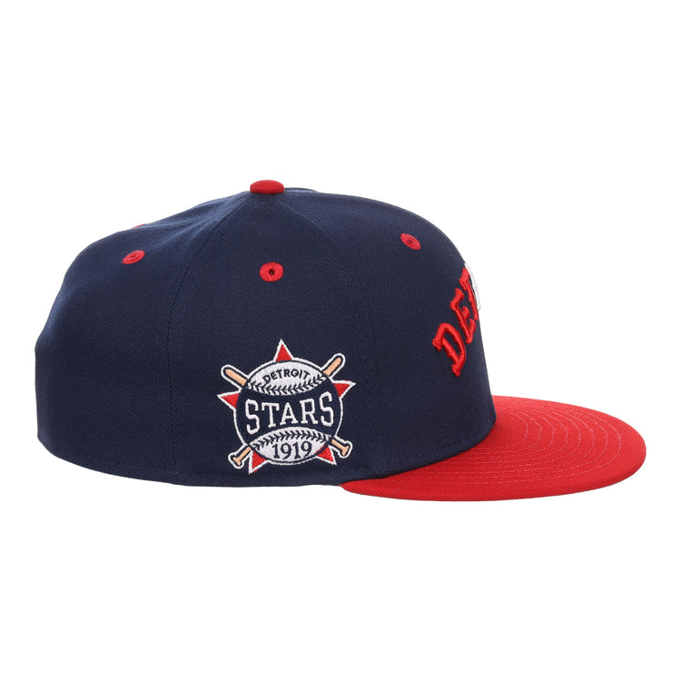 The EFF Detroit Stars NLB Flip Fitted Ballcap is a vintage-inspired navy cap with DETROIT in red, a matching brim, and a side patch reading “Detroit Stars 1919” with crossed bats and ball—honoring the Negro National League.