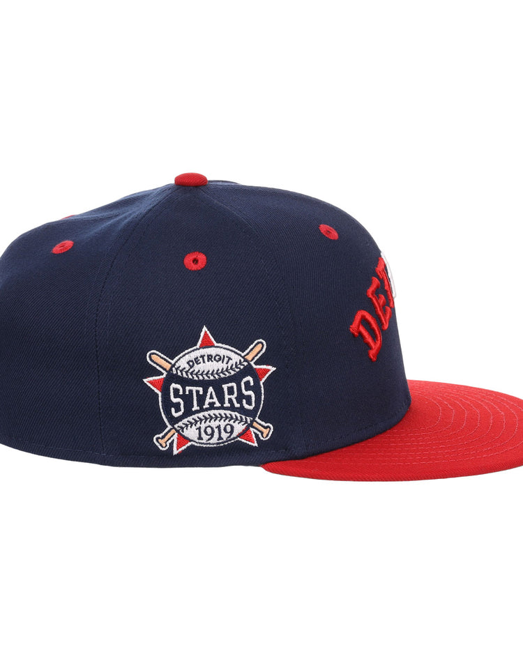 The EFF Detroit Stars NLB Flip Fitted Ballcap is a vintage-inspired navy cap with DETROIT in red, a matching brim, and a side patch reading “Detroit Stars 1919” with crossed bats and ball—honoring the Negro National League.