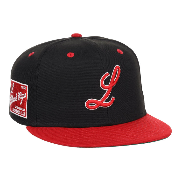 The EFF Louisville Black Caps NLB Flip Fitted Ballcap is a vintage-inspired black hat featuring a red brim and button, white and red script L, and a Louisville Slugger patch—honoring the Negro National League team.