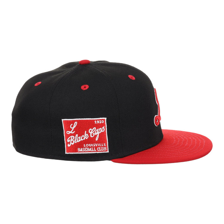The EFF Louisville Black Caps NLB Flip Fitted Ballcap is a vintage-inspired black cap with a red brim and a side patch reading L Black Caps Louisville Baseball Club 1930 in white, honoring Negro National League history.