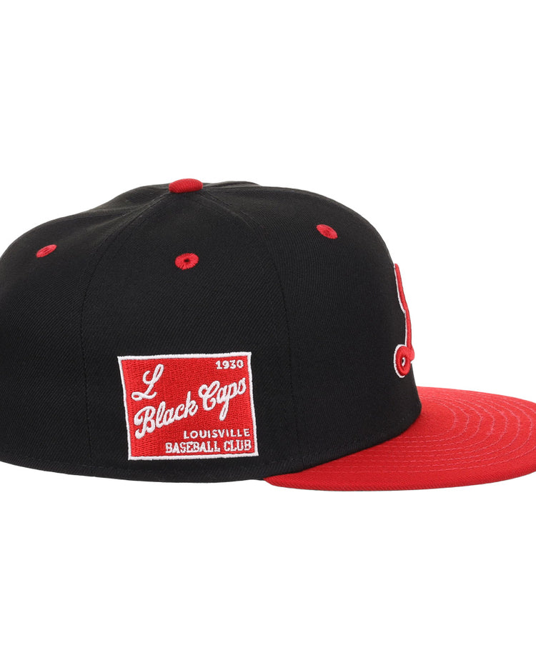 The EFF Louisville Black Caps NLB Flip Fitted Ballcap is a vintage-inspired black cap with a red brim and a side patch reading L Black Caps Louisville Baseball Club 1930 in white, honoring Negro National League history.
