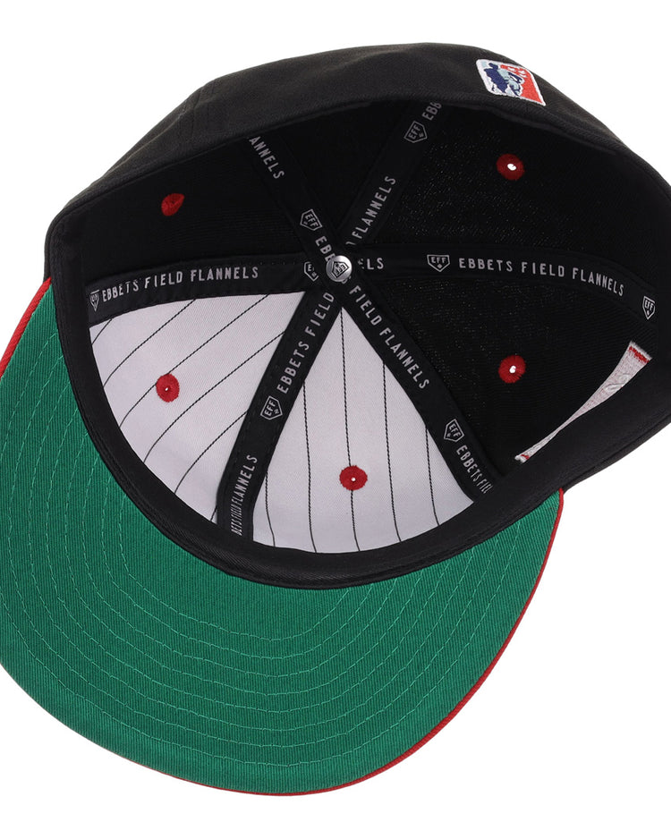 The EFF Louisville Black Caps NLB Flip Fitted Ballcap is a black vintage-inspired cap with a green underbrim, white pinstriped lining with red dots, and black inner bands labeled “Ebbetts Field Flannels.”.