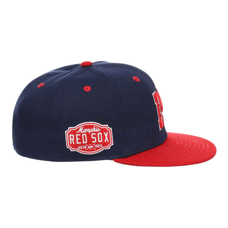 The EFF Memphis Red Sox NLB Flip Fitted Ballcap features navy blue and red colors, a red brim, a Memphis Red Sox side patch, and a bold red M front logo, honoring the Negro American Leagues legacy.