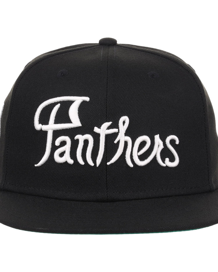 The EFF Montreal Black Panthers NLB Flip Fitted Ballcap is a vintage-inspired black cap featuring bold white Panthers embroidery on the front for a classic look.