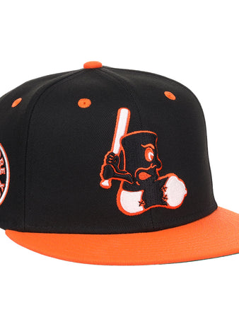 The EFF Baltimore Black Sox NLB Flip Fitted Ballcap features a vintage-inspired design with an embroidered cartoon bird, a side Baltimore Black Sox patch, and bold orange brim and button honoring the team’s Eastern Colored League legacy.