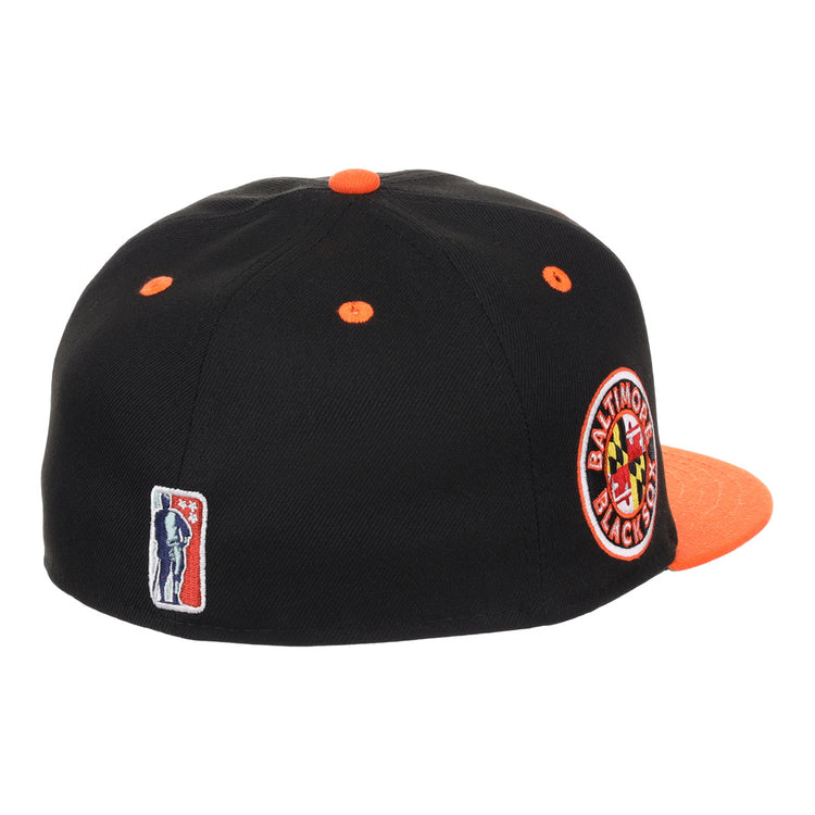 The EFF Baltimore Black Sox NLB Flip Fitted Ballcap features a black crown with orange accents, a round side patch honoring the teams Eastern Colored League legacy, and vintage-inspired style.
