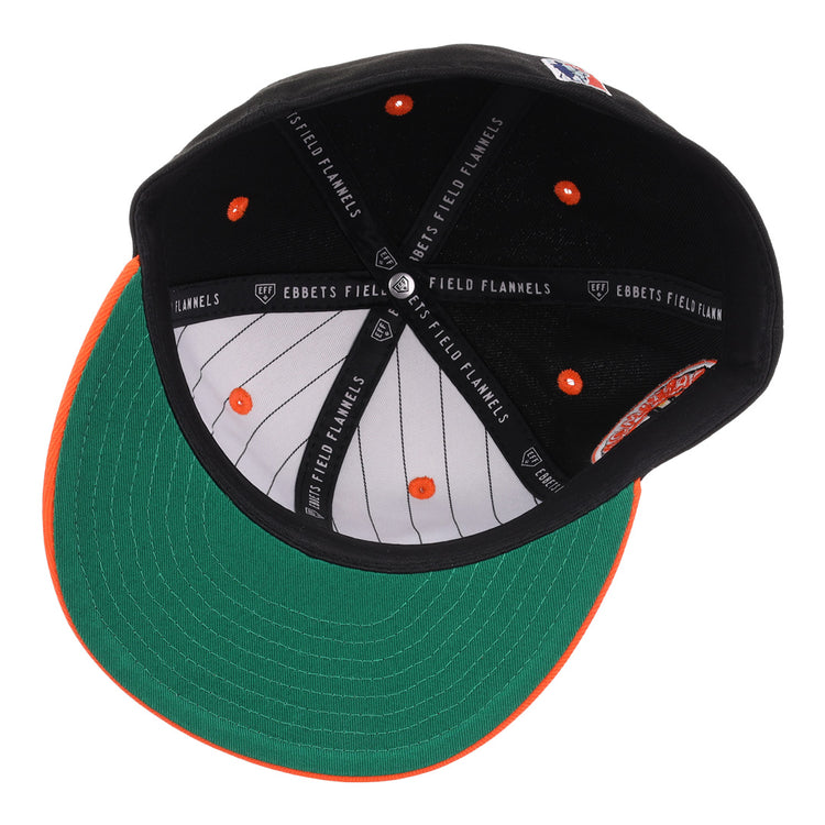 An overhead view of the EFF Baltimore Black Sox NLB Flip Fitted Ballcap reveals a green underbrim, black and orange interior, white pinstriped lining, and signature EFF branding—honoring the legacy of the Eastern Colored League.