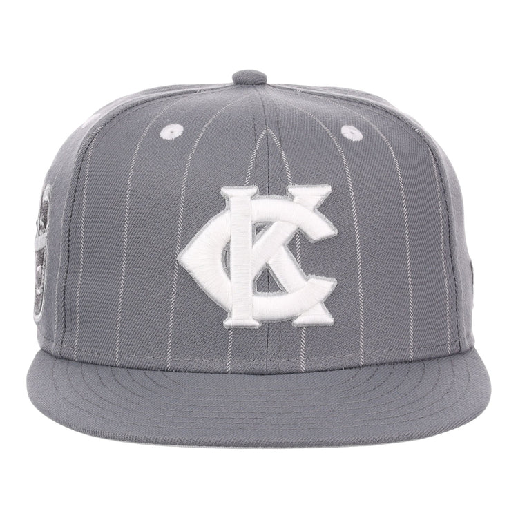 The EFF Kansas City Monarchs NLB Black Pinstripe Fitted Ballcap features black pinstripes, a flat brim, and a bold white KC logo inspired by the Monarchs Baseball Logo, celebrating Negro National League heritage.