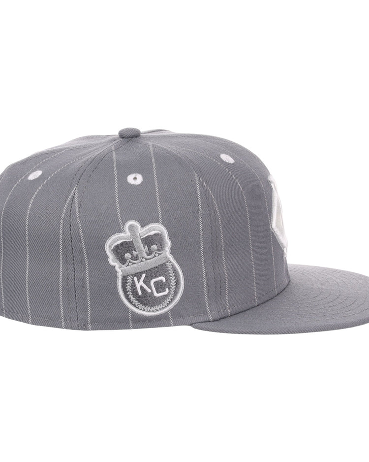 The EFF Kansas City Monarchs NLB Black Pinstripe Fitted Ballcap features gray pinstripes, a flat brim, and embroidered crown, KC, and Monarchs Baseball logos—honoring the Negro National League and classic vintage style.
