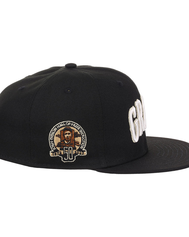 The EFF Homestead Grays Josh Gibson Fitted Ballcap in black features white embroidered lettering, a side patch with Josh Gibson’s portrait, “50,” and “Hall of Fame Induction” in gold and white, making it a true limited edition hat.
