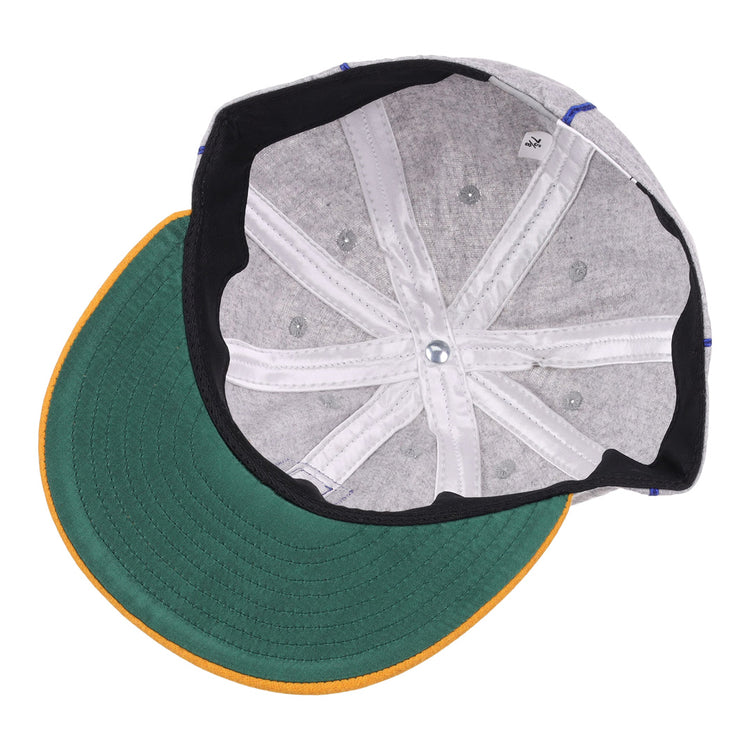 The underside of the EFF Pasadena Merchants 1919 Vintage 8-Panel Ballcap features a green brim with yellow edge, gray interior panels, white stitching, and a top-center button—echoing classic California Winter League style.
