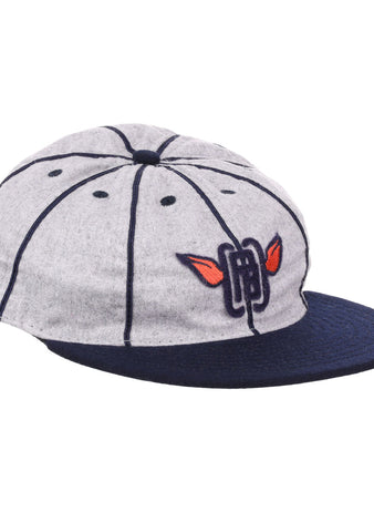 The EFF Columbia Park 1909 Vintage 8-Panel Ballcap is a gray cap with a navy visor and seams, featuring an embroidered blue letters and red wings logo on the front, inspired by classic Columbia Park Boys Club style.