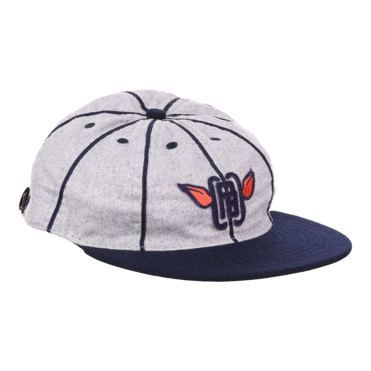 The EFF Columbia Park 1909 Vintage 8-Panel Ballcap is a gray cap with a navy visor and seams, featuring an embroidered blue letters and red wings logo on the front, inspired by classic Columbia Park Boys Club style.