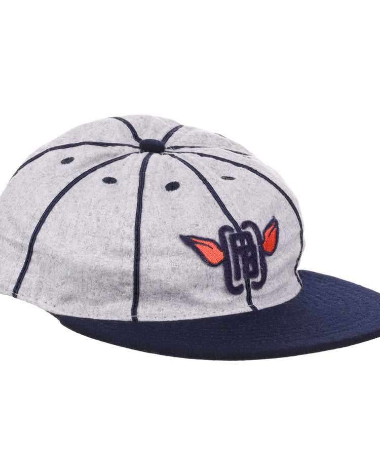 The EFF Columbia Park 1909 Vintage 8-Panel Ballcap is a gray cap with a navy visor and seams, featuring an embroidered blue letters and red wings logo on the front, inspired by classic Columbia Park Boys Club style.
