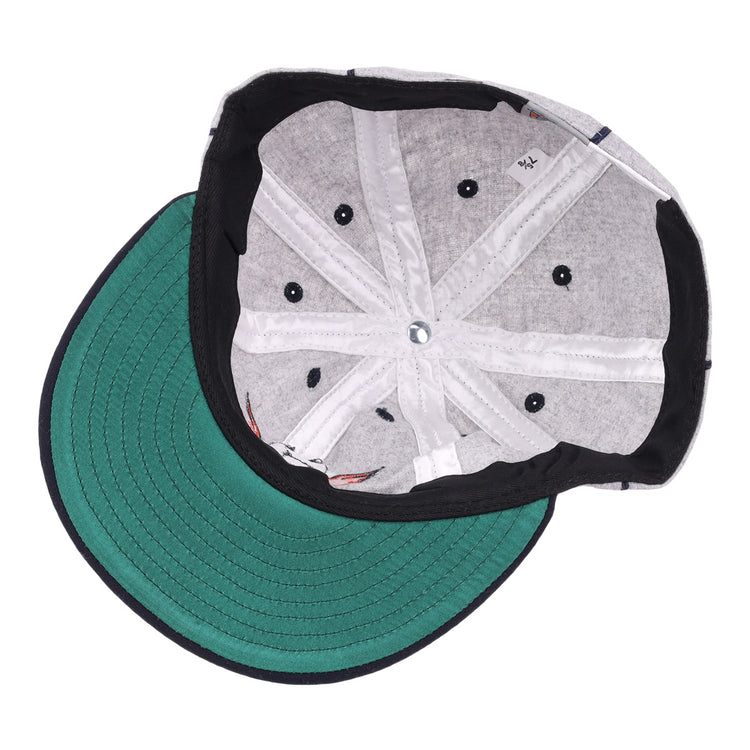 The image shows the inside of an EFF Columbia Park 1909 Vintage 8-Panel Ballcap with a green brim, gray lining, black sweatband, visible stitching, and ventilation holes. The cap is laid flat with the brim facing left.