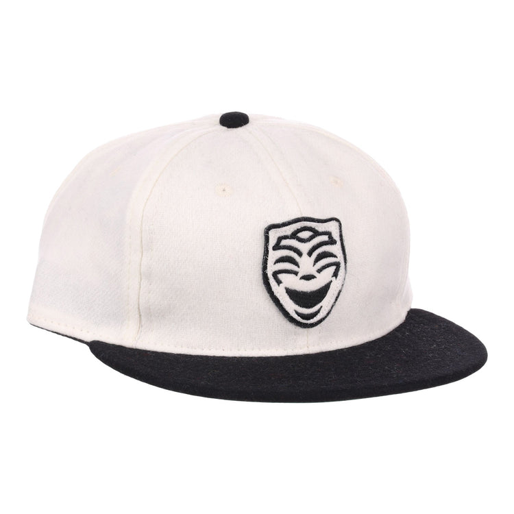 The EFF Thespians 1919 Vintage Ballcap is a white cap with a black brim and a black embroidered comedy mask logo, authentically reproduced from the classic 1919 design.