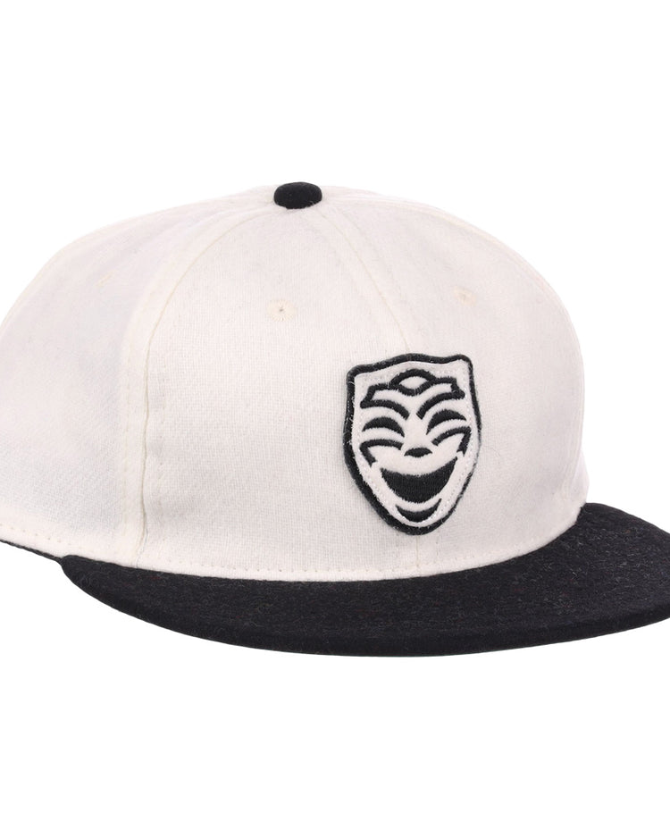 The EFF Thespians 1919 Vintage Ballcap is a white cap with a black brim and a black embroidered comedy mask logo, authentically reproduced from the classic 1919 design.