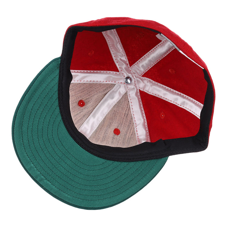 A top-down view of the EFF M&O Cigars 1946 Vintage Ballcap reveals white stitched panels, a green brim, red ventilation holes, and a silver center button.