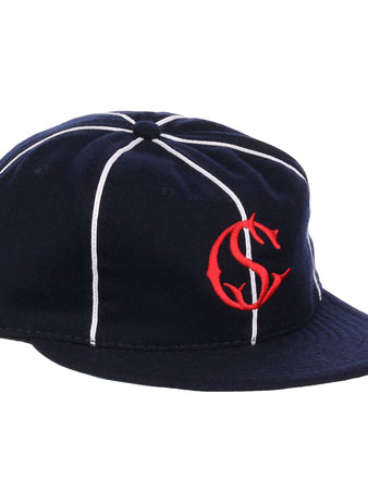 The EFF Santa Cruz Crabs 1908 Vintage Ballcap features navy blue wool with white stripes and a red interlocking “C” and “S” logo on the front, offering a timeless, classic baseball style.