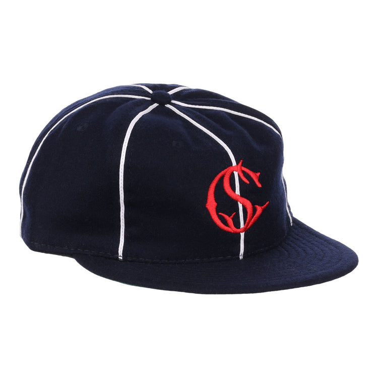 The EFF Santa Cruz Crabs 1908 Vintage Ballcap features navy blue wool with white stripes and a red interlocking “C” and “S” logo on the front, offering a timeless, classic baseball style.