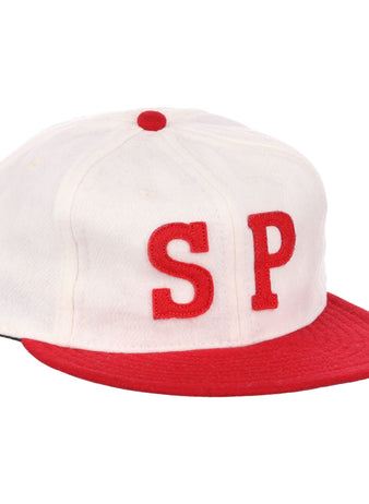 The EFF Nebraska State Prison 1923 Vintage Ballcap is a wool cap with a white crown, red brim and button, and bold red SP letters—an authentic reproduction of the original prison team hat.