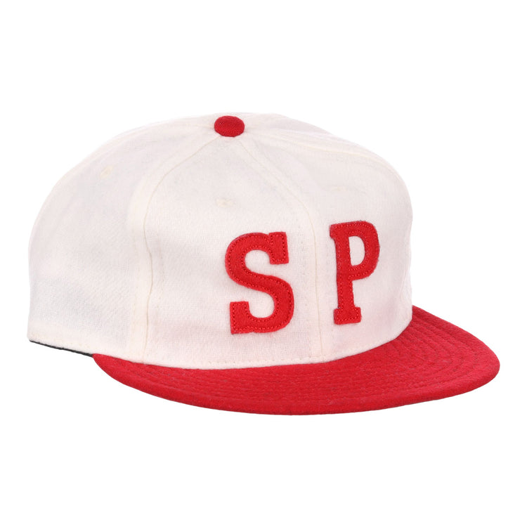 The EFF Nebraska State Prison 1923 Vintage Ballcap is a wool cap with a white crown, red brim and button, and bold red SP letters—an authentic reproduction of the original prison team hat.