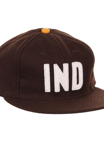 The EFF Independent Subway System 1939 Vintage Ballcap is a genuine wool brown cap with a yellow top button and bold white IND letters, inspired by the historic 1939 subway ballcap.