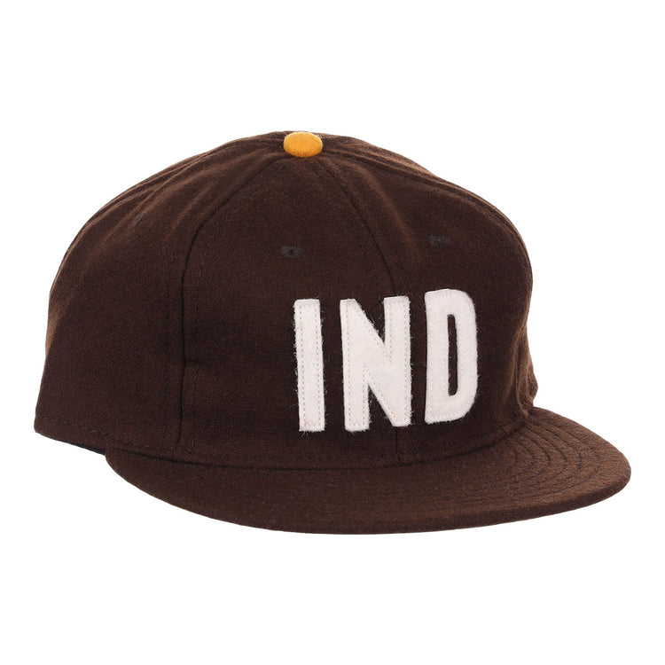 The EFF Independent Subway System 1939 Vintage Ballcap is a genuine wool brown cap with a yellow top button and bold white IND letters, inspired by the historic 1939 subway ballcap.
