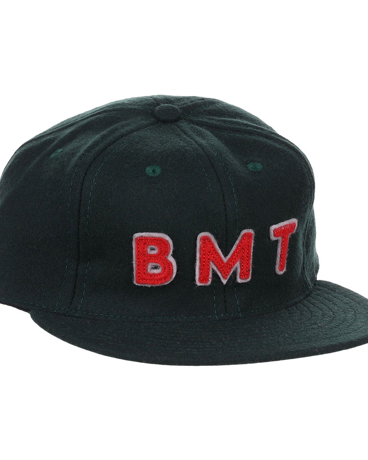 The EFF Brooklyn Manhattan Transit Company 1939 Vintage Ballcap is a black wool cap featuring raised red and white BMT embroidery on the front, inspired by an original 1939 Brooklyn ballcap for authentic vintage style.