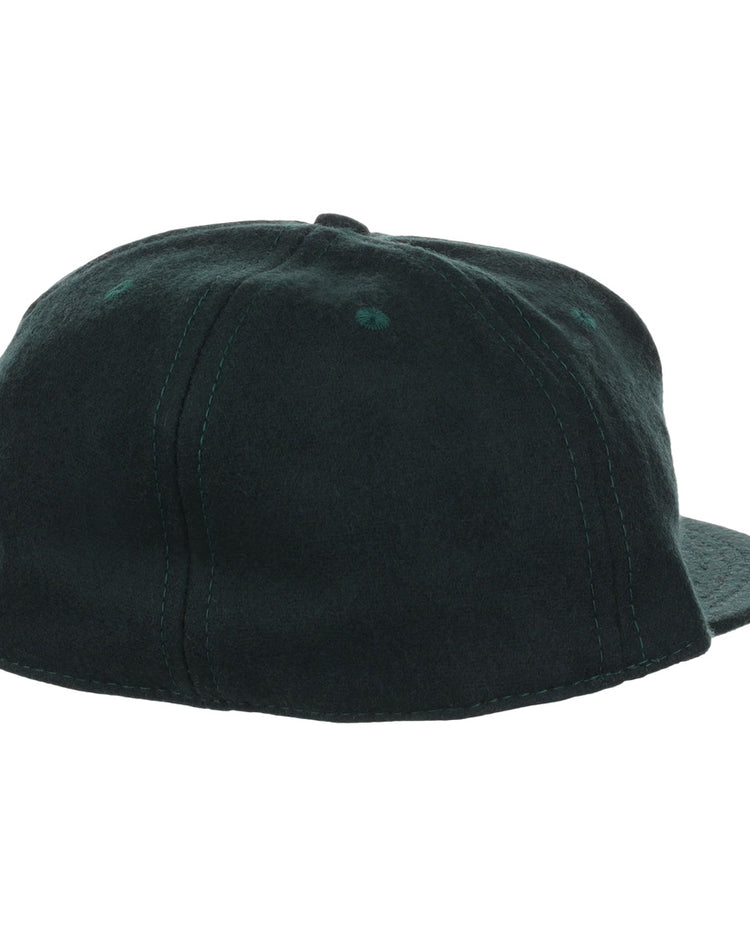 The EFF Brooklyn Manhattan Transit Company 1939 Vintage Ballcap is a dark green wool hat shown from the back, featuring sealed paneling and visible seam and brim stitching—a classic throwback to vintage BMT style.