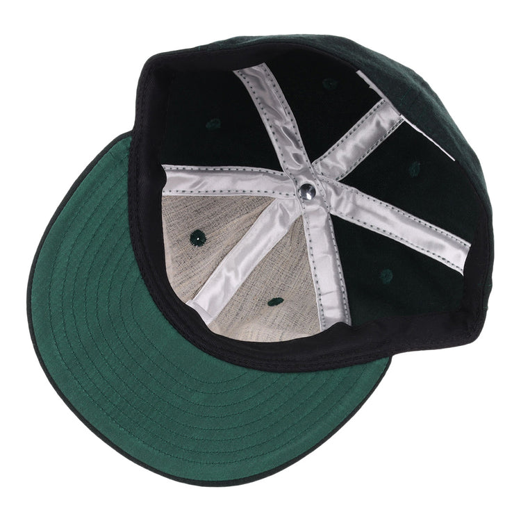 A look inside the EFF Brooklyn Manhattan Transit Company 1939 Vintage Ballcap reveals its green flat brim, black inner band, silver lining strips, and visible stitching.