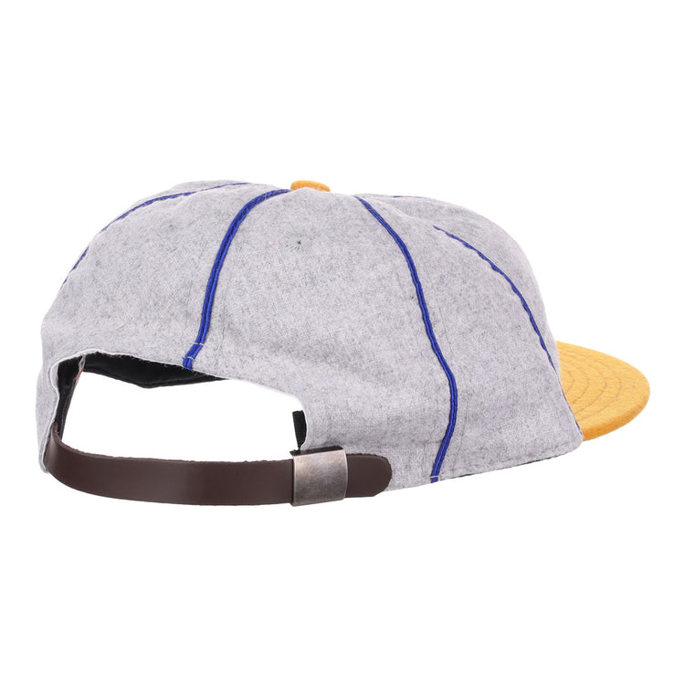 The EFF Pasadena Merchants 1919 Vintage 8-Panel Ballcap is a wool cap in gray with blue stitching, a yellow brim, and a brown adjustable strap with metallic clasp—shown from the rear, evoking classic California Winter League style.