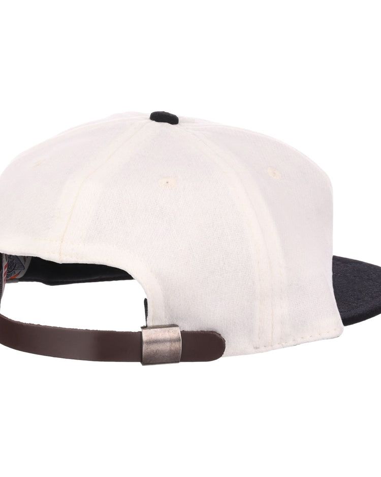 The EFF Thespians 1919 Vintage Ballcap is white with a black brim, shown from the back with a brown leather adjustable strap and metal buckle—an authentic classic reproduction.