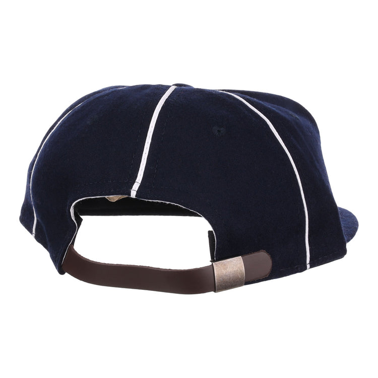 The back of the EFF Santa Cruz Crabs 1908 Vintage Ballcap in navy with white piping features an adjustable brown strap and metal clasp, all crafted from genuine wool baseball cloth.
