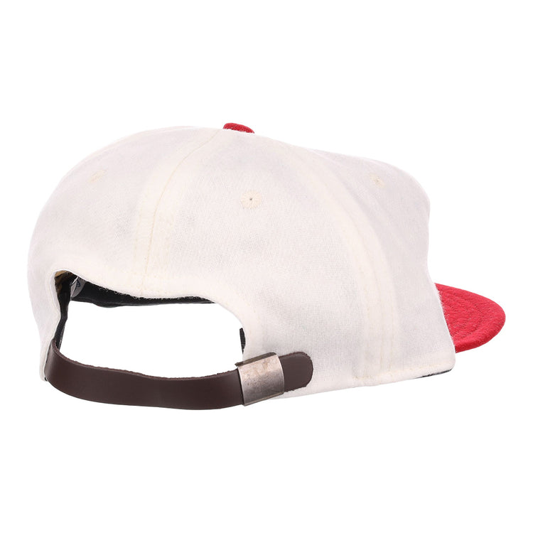 The EFF Nebraska State Prison 1923 Vintage Ballcap is a white wool cap with a red brim, shown from the back with an adjustable brown leather strap and metal clasp—an authentic reproduction from 1923.