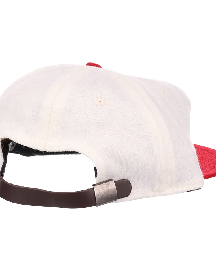 The EFF Nebraska State Prison 1923 Vintage Ballcap is a white wool cap with a red brim, shown from the back with an adjustable brown leather strap and metal clasp—an authentic reproduction from 1923.
