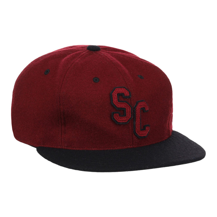 The EFF University of South Carolina Gamecocks Vintage Ballcap is a maroon wool cap with a black brim, featuring SC in black with white outline on the front; an officially licensed College Vault product.