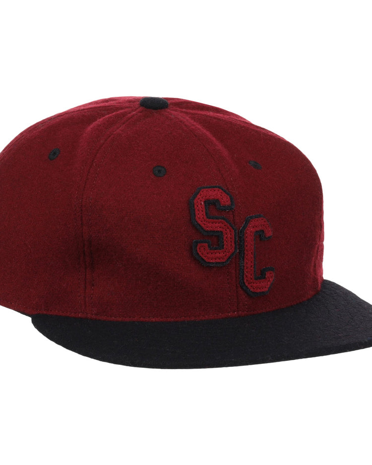 The EFF University of South Carolina Gamecocks Vintage Ballcap is a maroon wool cap with a black brim, featuring SC in black with white outline on the front; an officially licensed College Vault product.