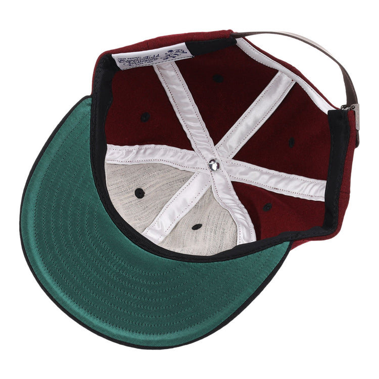 A look inside the EFF University of South Carolina Gamecocks Vintage Ballcap reveals a green underbrim, burgundy crown, white seams, black eyelets, and an adjustable strap—an officially licensed College Vault item.