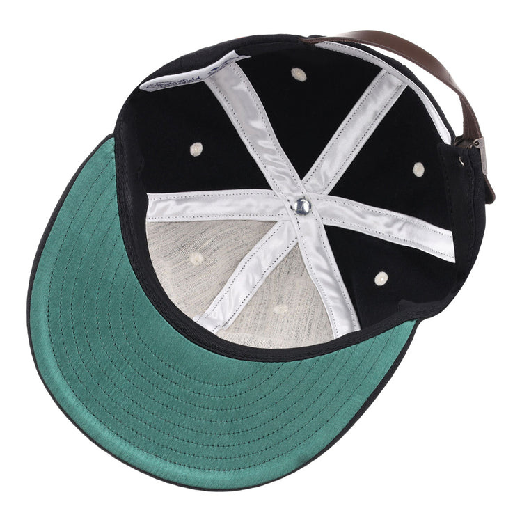 The image shows the inside view of the EFF University of South Carolina Gamecocks Mascot Vintage Ballcap, featuring a black design with a green brim underside, white stitching, metal eyelets, and an adjustable leather back strap.