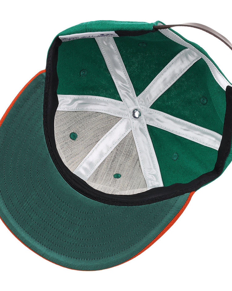 A top-down view of the EFF Florida A&M University 1969 Vintage Ballcap, featuring a green crown, orange brim, white interior seams, and adjustable brown strap—authentic wool design with classic style.
