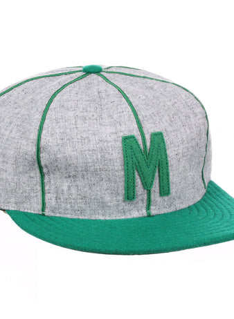 The EFF Manhattan College 1932 Vintage Ballcap features genuine wool in gray and green, with a green letter M, matching stitching, brim, and top button.