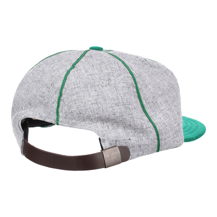 The EFF Manhattan College 1932 Vintage Ballcap is crafted from genuine wool baseball cloth in gray, with green stitching, a green brim, and an adjustable brown leather strap with metal clasp.
