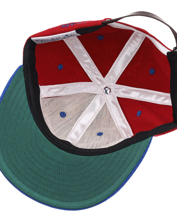The EFF Southern Methodist University Mascot Vintage Ballcap features white stitched panels, blue ventilation holes, a green underbrim, and an adjustable brown strap—classic elements of a collegiate wool cap.