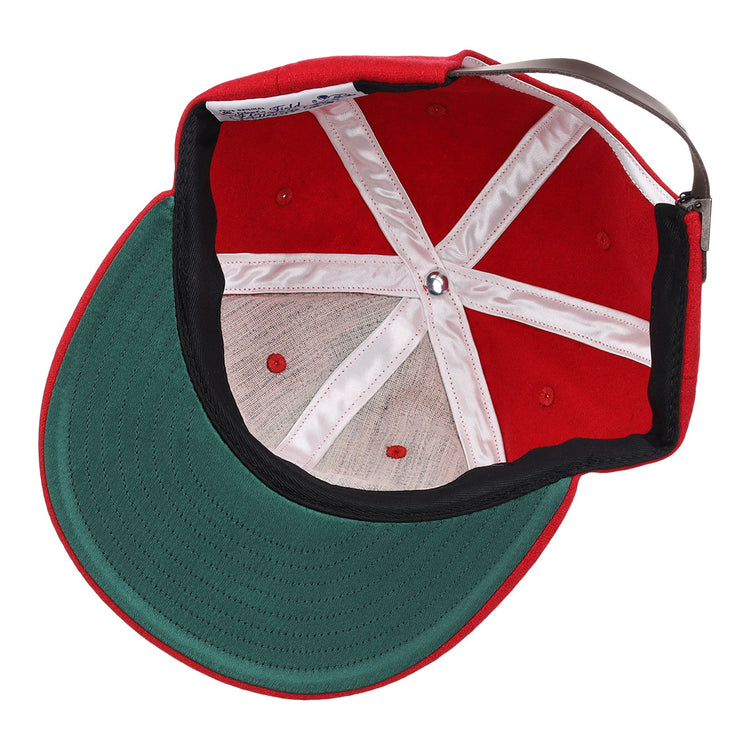 A top-down view of the EFF Coastal Carolina University 1968 Vintage Ballcap shows a red wool hat with a green brim, white inner lining, visible stitching, open structure, and adjustable strap—classic charm in every detail.