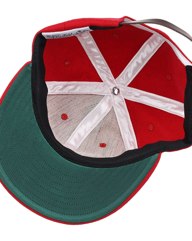 A top-down view of the EFF Coastal Carolina University 1968 Vintage Ballcap shows a red wool hat with a green brim, white inner lining, visible stitching, open structure, and adjustable strap—classic charm in every detail.